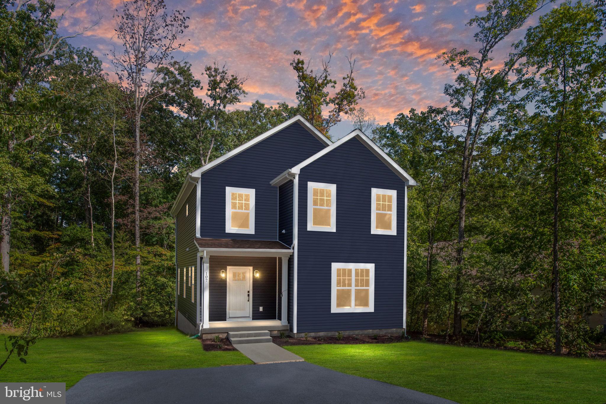107 Saylers Creek Road Locust Grove, VA 22508 - Photo 66 of 78 a view of a brick house next to a yard with big trees
