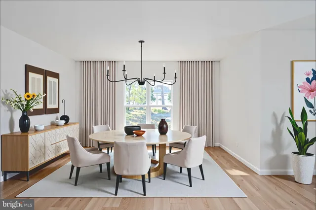 a kitchen with stainless steel appliances kitchen island granite countertop a stove a sink a dining table and chairs with wooden floor