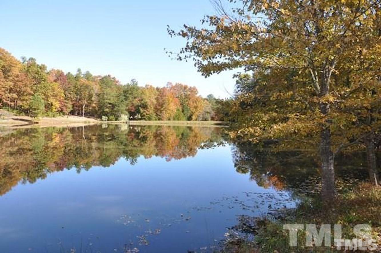 325 Pasture Lane Raleigh, NC 27614 - Photo 1 of 12 a view of lake with green space
