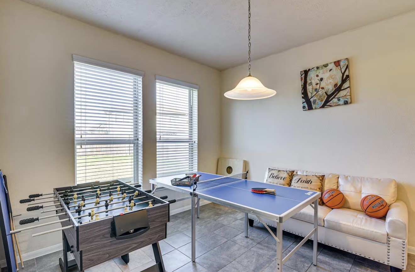 15015 Winter Valley Court Humble, TX 77396 - Photo 11 of 39 a living room with furniture a rug and a window
