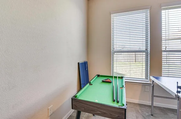 a room with window and a chair