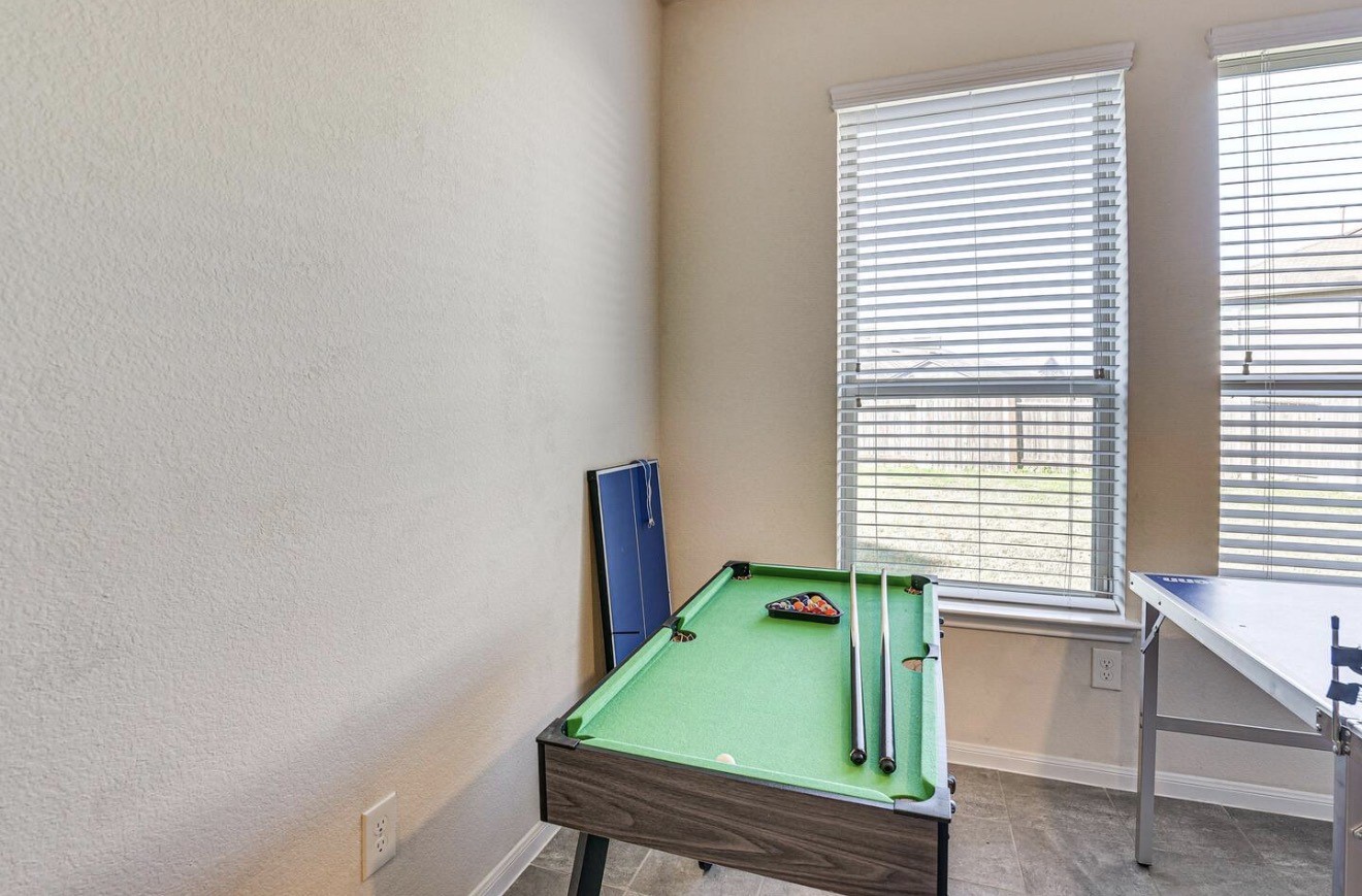 15015 Winter Valley Court Humble, TX 77396 - Photo 12 of 39 a room with window and a chair