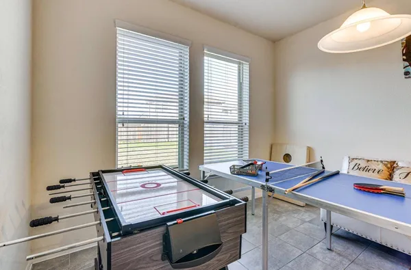 a room with chairs and a window