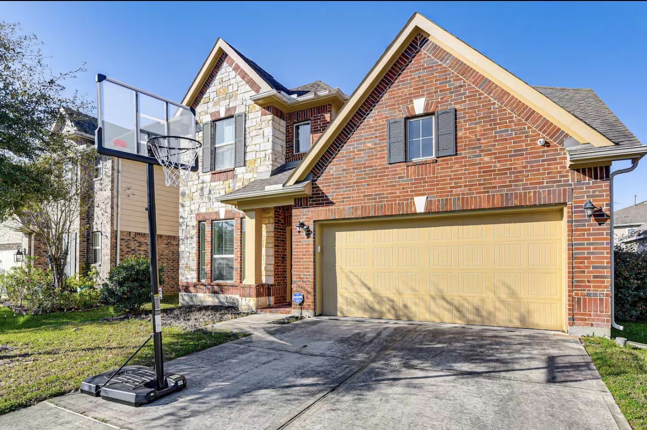 15015 Winter Valley Court Humble, TX 77396 - Photo 2 of 39 a front view of a house with garden