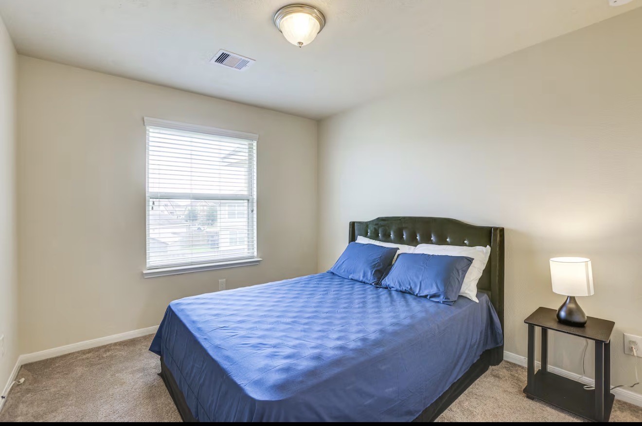 15015 Winter Valley Court Humble, TX 77396 - Photo 26 of 39 a bedroom with a bed and window