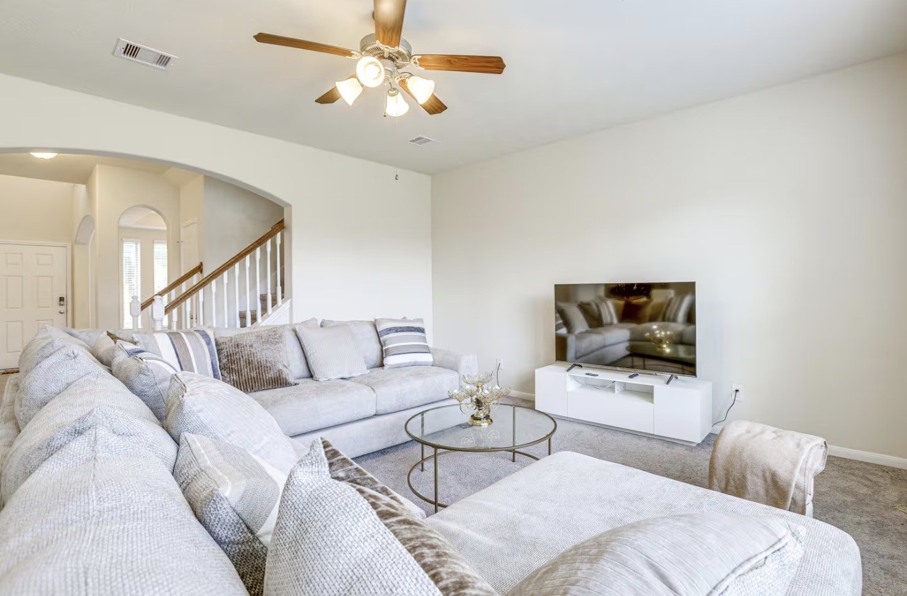 15015 Winter Valley Court Humble, TX 77396 - Photo 5 of 39 a living room with furniture and a flat screen tv