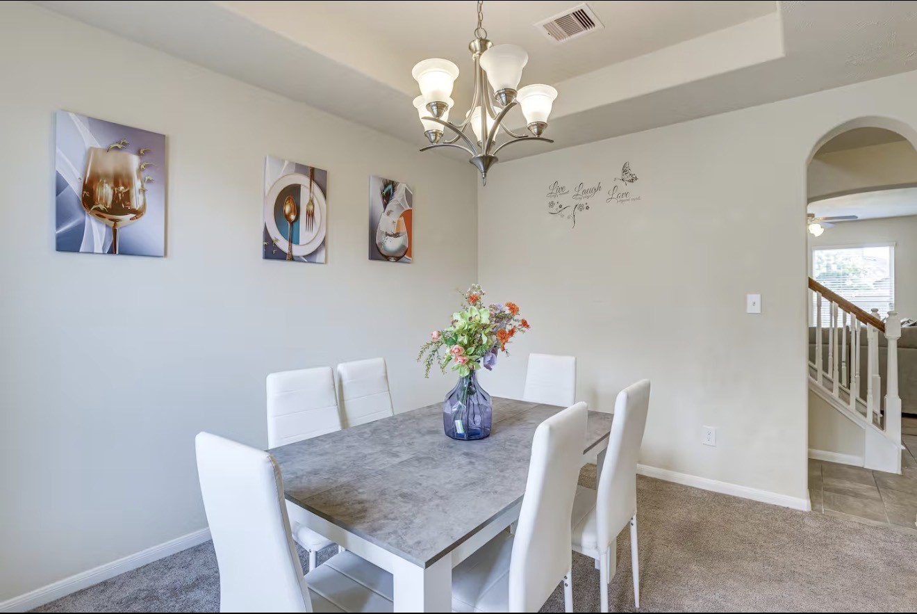 15015 Winter Valley Court Humble, TX 77396 - Photo 7 of 39 a dining room with furniture and chandelier