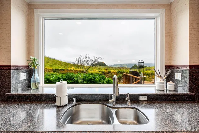 a view of a dining room with furniture window and outside view