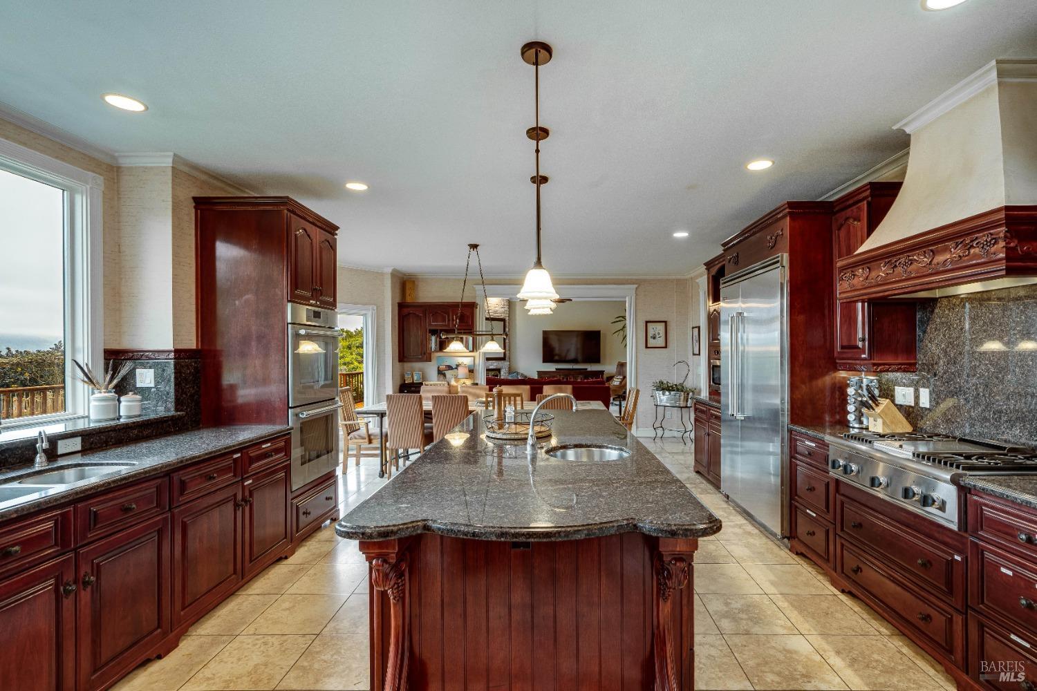 4720 Guenza Road Santa Rosa, CA 95404 - Photo 14 of 94 a kitchen with stainless steel appliances kitchen island granite countertop a stove a sink and a refrigerator