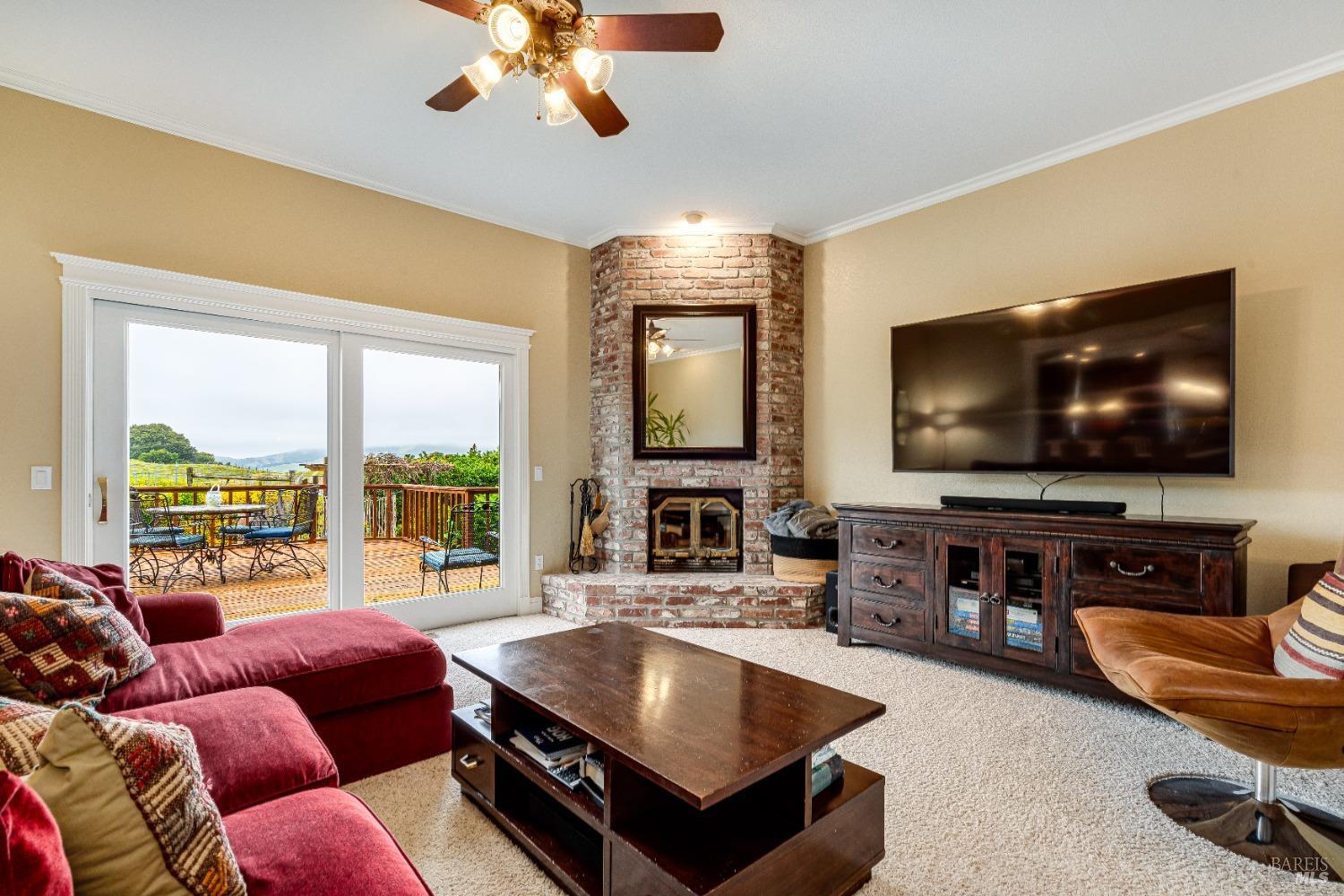 4720 Guenza Road Santa Rosa, CA 95404 - Photo 22 of 94 a living room with furniture and a flat screen tv