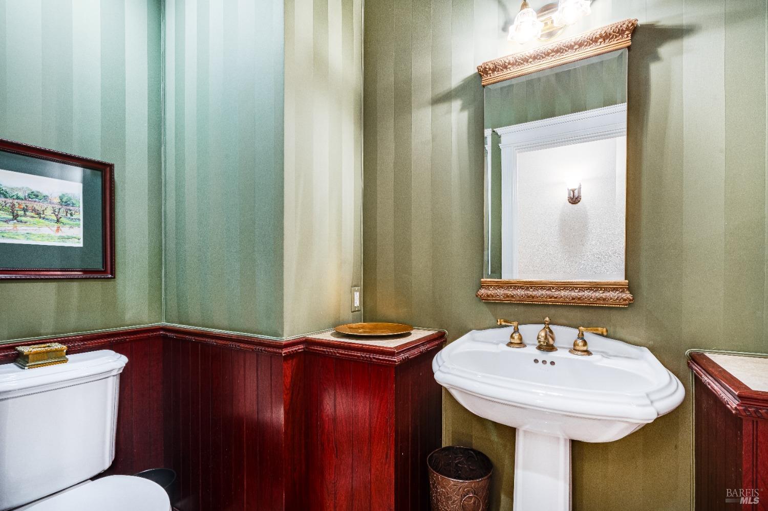 4720 Guenza Road Santa Rosa, CA 95404 - Photo 40 of 94 a bathroom with a sink and a mirror