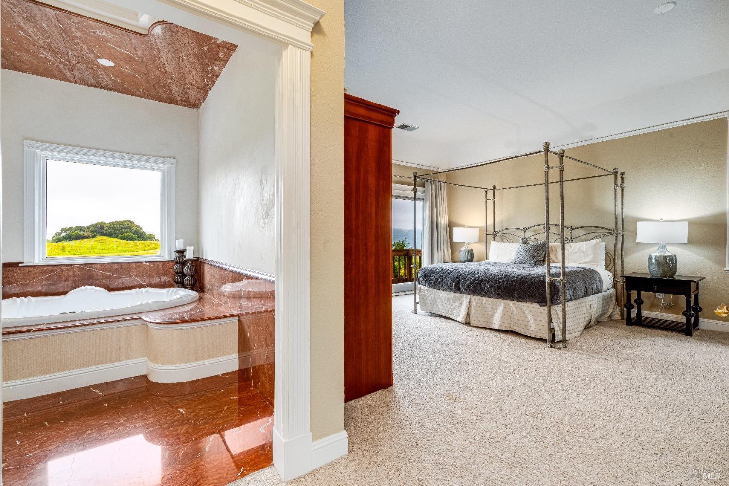 4720 Guenza Road Santa Rosa, CA 95404 - Photo 45 of 94 a bedroom with a bed and a lamp on dresser