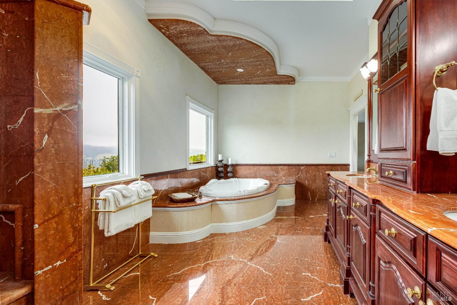 4720 Guenza Road Santa Rosa, CA 95404 - Photo 50 of 94 a bathroom with a granite countertop sink and a mirror