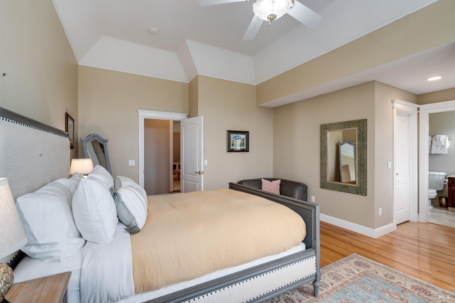 4720 Guenza Road Santa Rosa, CA 95404 - Photo 53 of 94 a bedroom with a bed and wooden floor