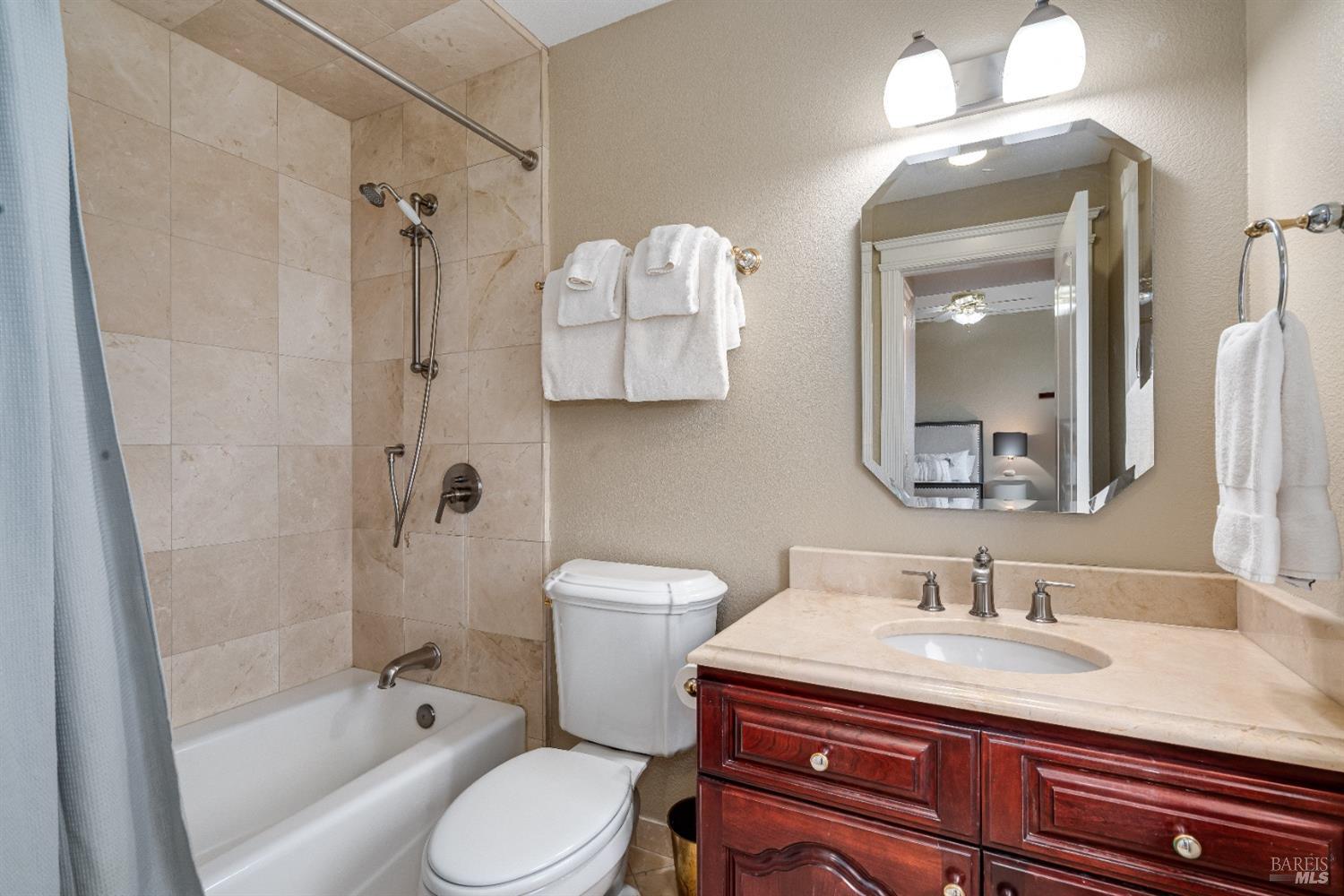 4720 Guenza Road Santa Rosa, CA 95404 - Photo 54 of 94 a bathroom with a granite countertop sink toilet and shower