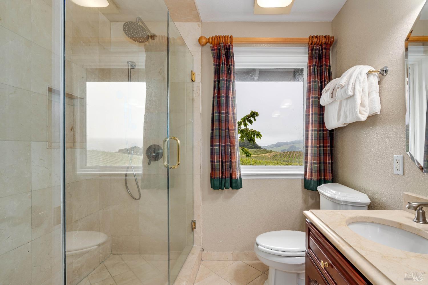 4720 Guenza Road Santa Rosa, CA 95404 - Photo 60 of 94 a bathroom with a sink toilet and shower