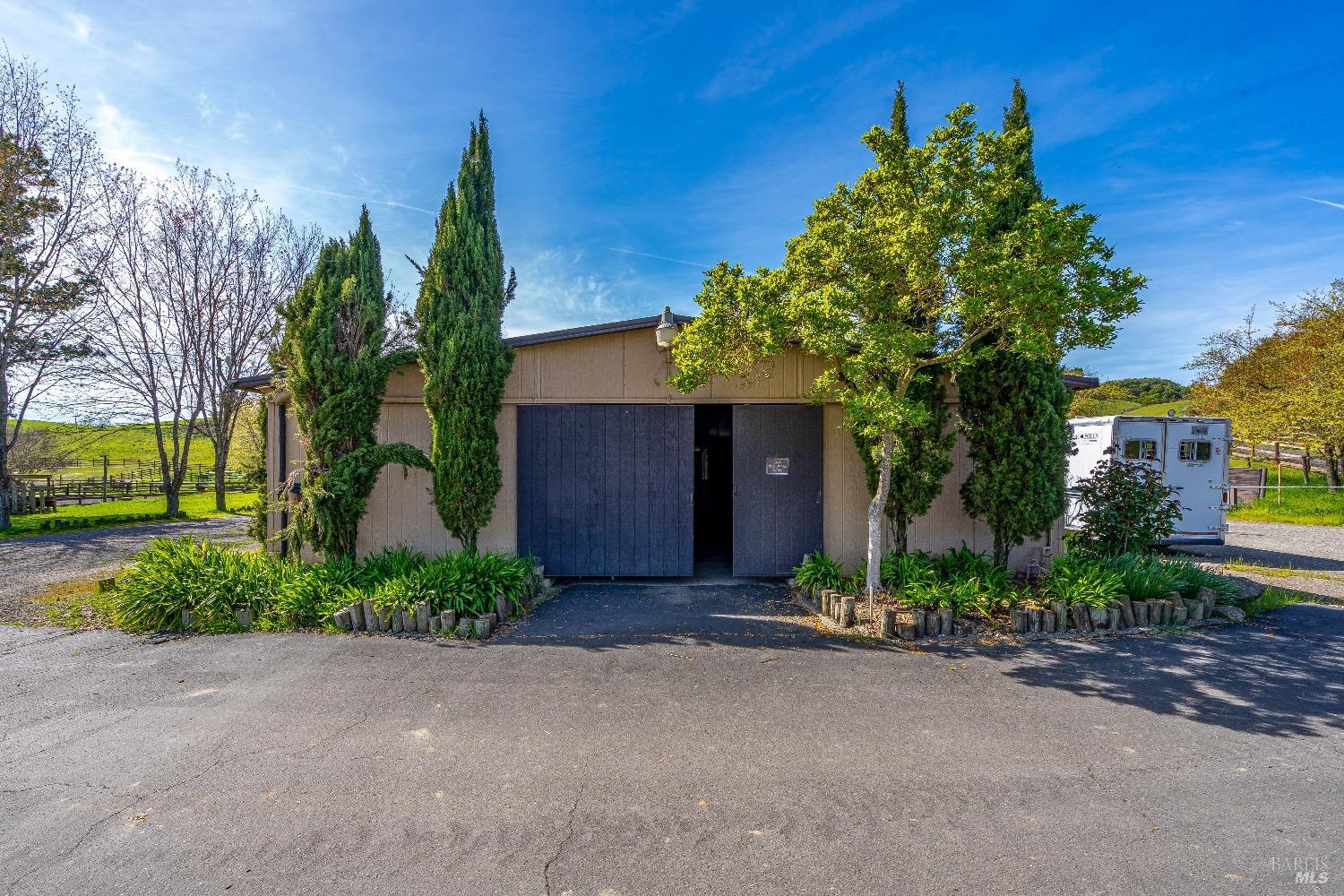 4720 Guenza Road Santa Rosa, CA 95404 - Photo 67 of 94 a front view of a house with a yard and tree s