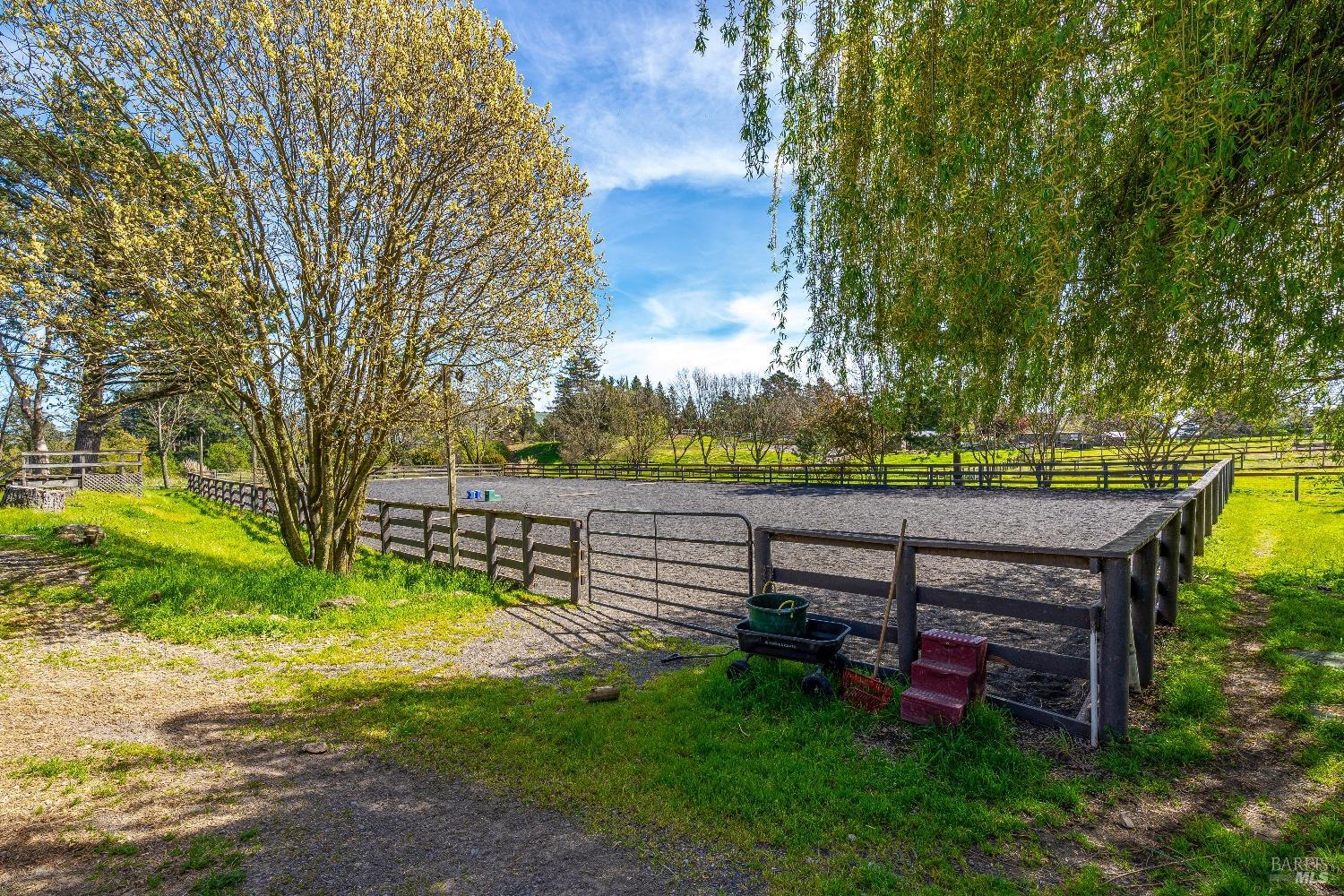 4720 Guenza Road Santa Rosa, CA 95404 - Photo 73 of 94 a view of a bench in the garden near a lake