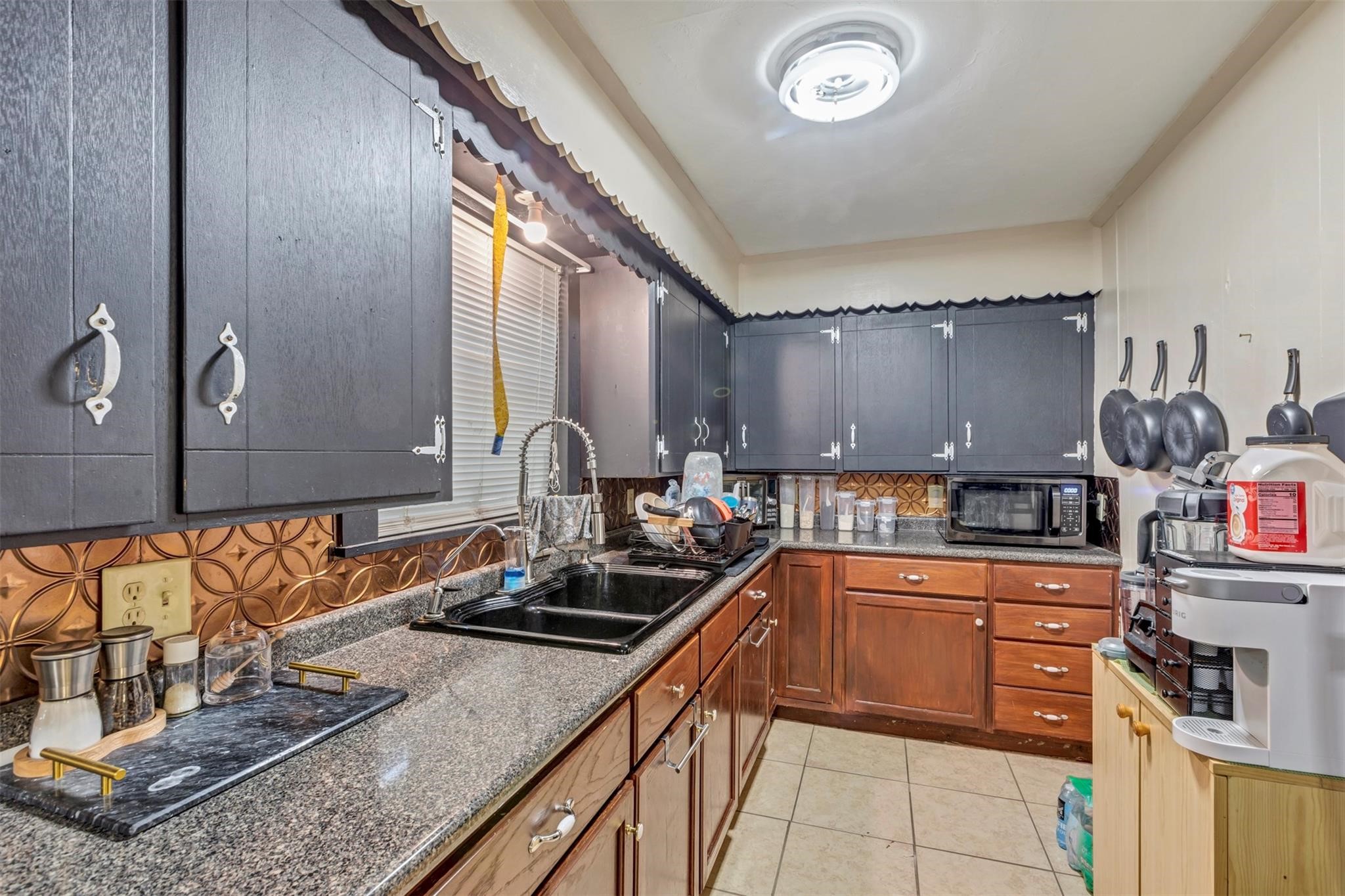 808 Morrell Street Baytown, TX 77520 - Photo 23 of 25 a kitchen with stainless steel appliances granite countertop a sink stove and cabinets
