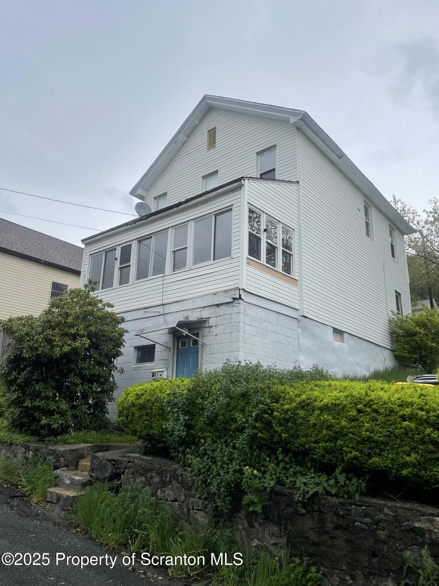 841 Hill Street Archbald, PA 18403 - Photo 1 of 22 a front view of a house with a yard