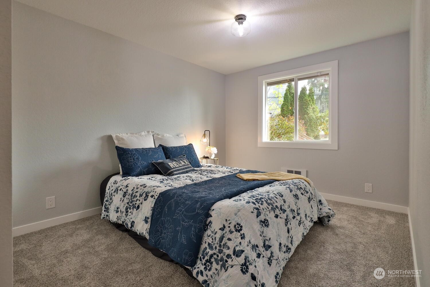 21704 4th Avenue West Bothell, WA 98021 - Photo 17 of 23 a bedroom with a bed and a window