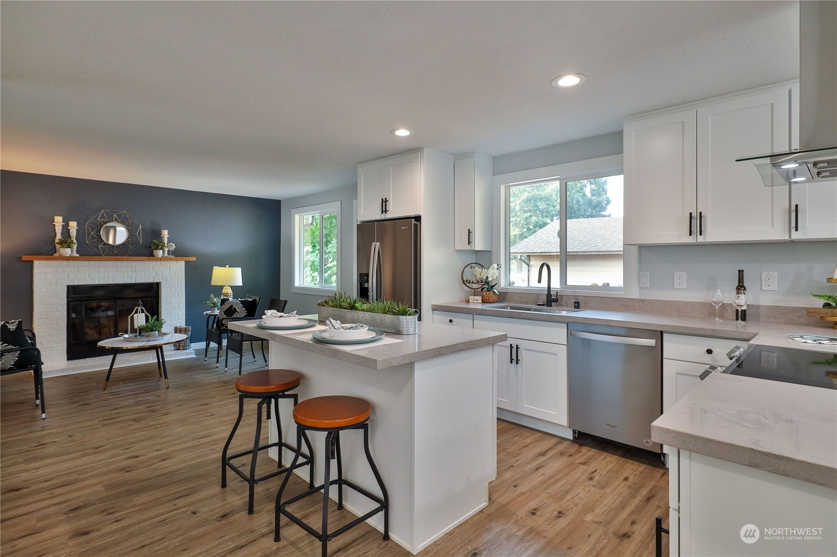 21704 4th Avenue West Bothell, WA 98021 - Photo 9 of 23 a kitchen with sink cabinets and dining table