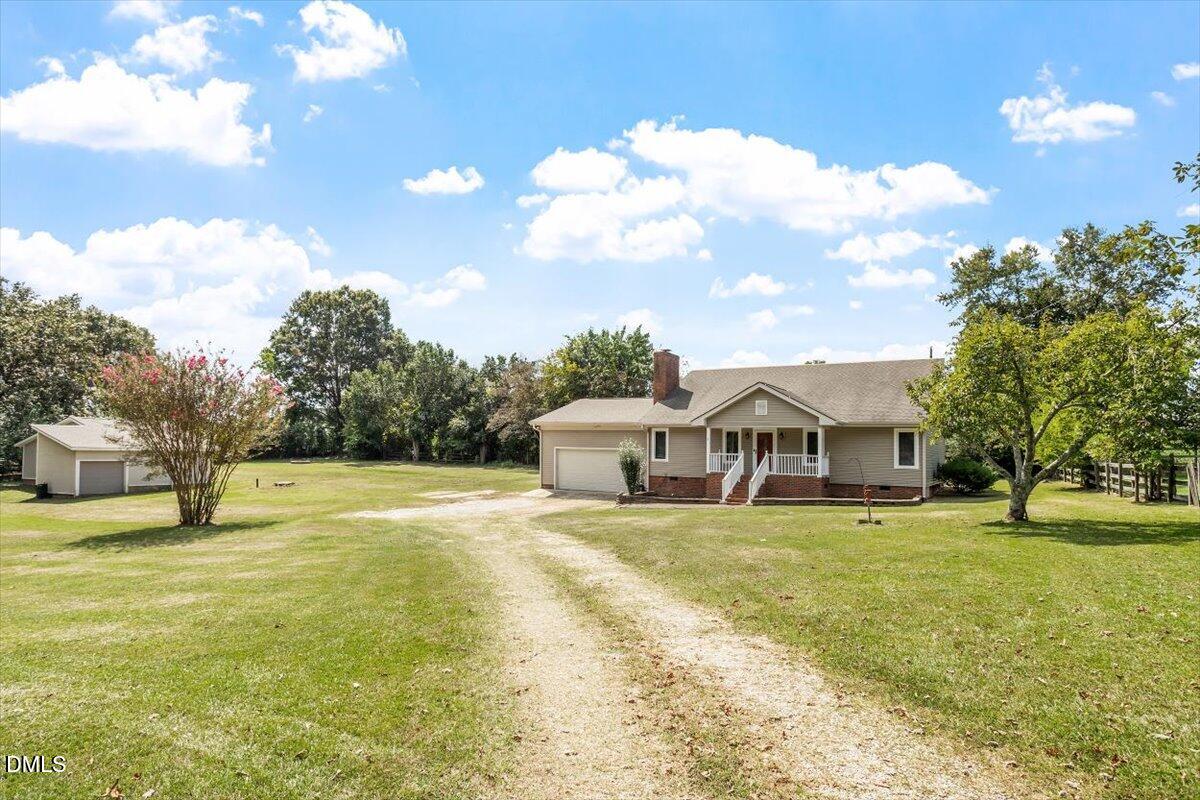 9966 US Highway 421 South Erwin, NC 28339 - Photo 1 of 34 a front view of a house with a yard