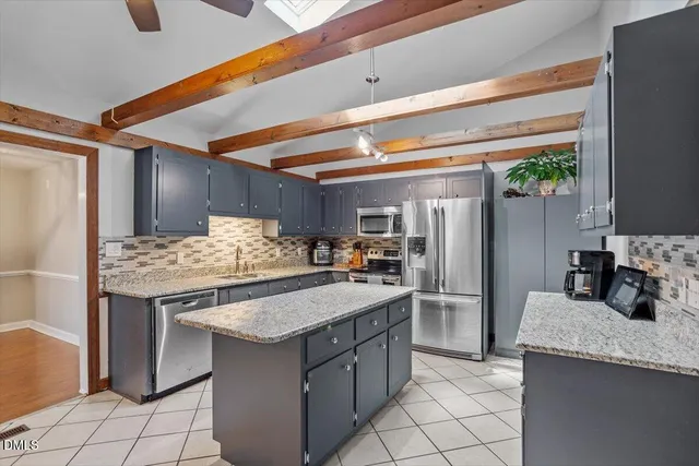a kitchen with a stove and refrigerator