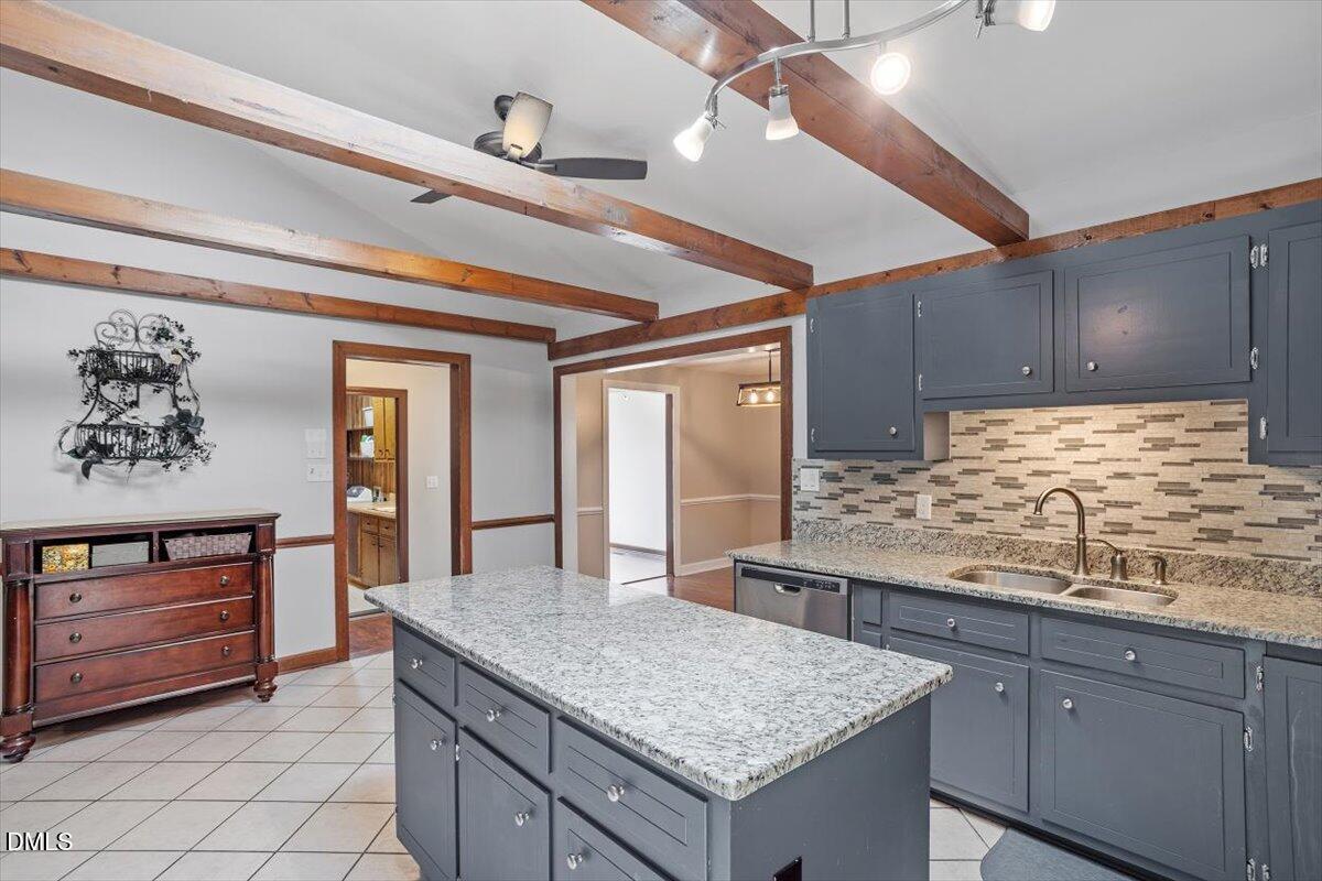 9966 US Highway 421 South Erwin, NC 28339 - Photo 18 of 34 a kitchen with granite countertop a sink and cabinets
