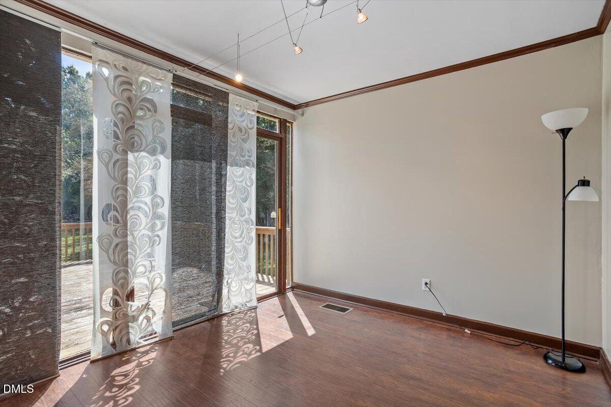 9966 US Highway 421 South Erwin, NC 28339 - Photo 20 of 34 a view of a room with wooden floor and windows