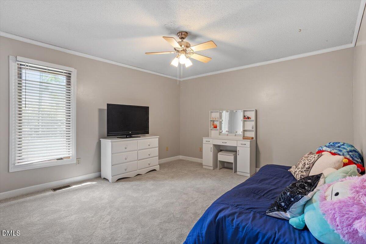 9966 US Highway 421 South Erwin, NC 28339 - Photo 28 of 34 a bedroom with a bed and a flat screen tv