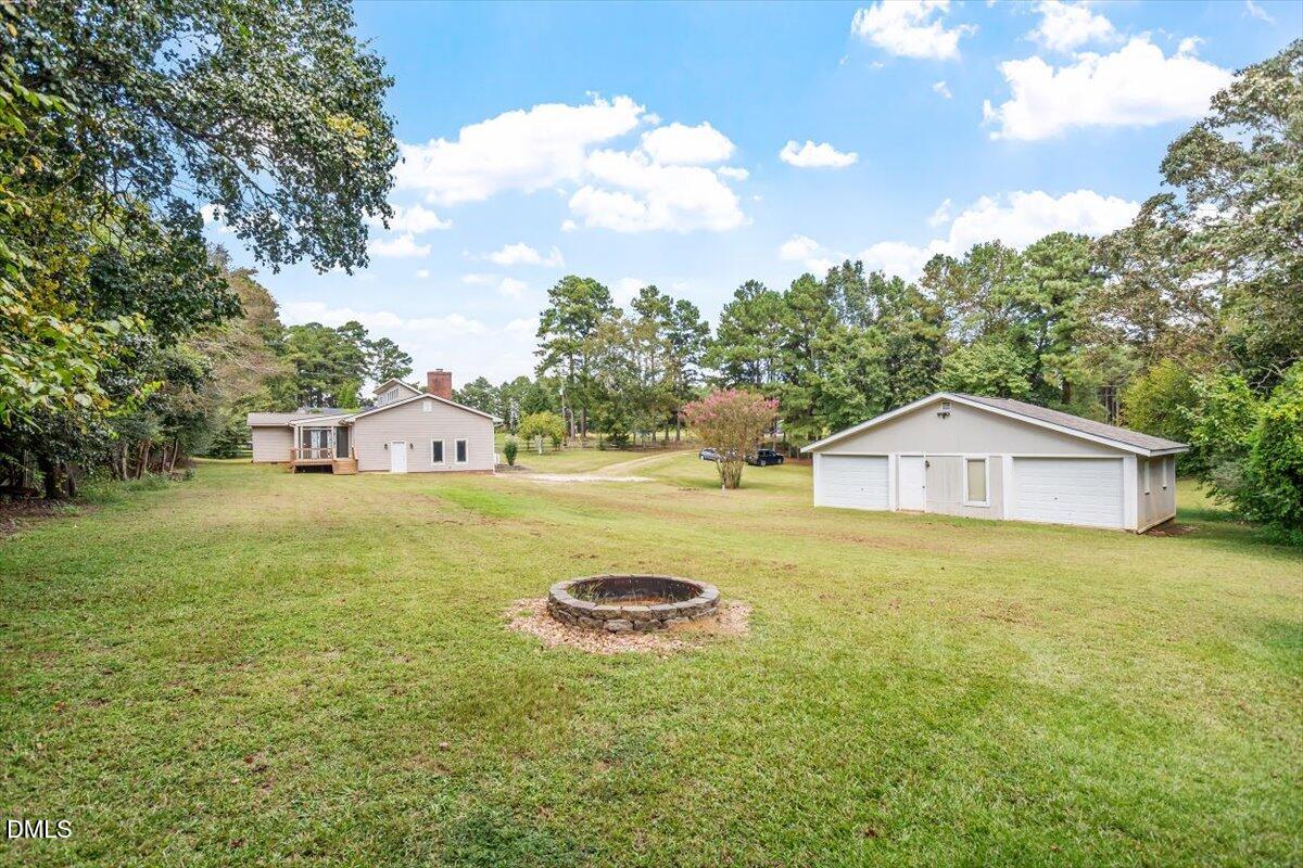 9966 US Highway 421 South Erwin, NC 28339 - Photo 32 of 34 a view of a house with a yard and trees