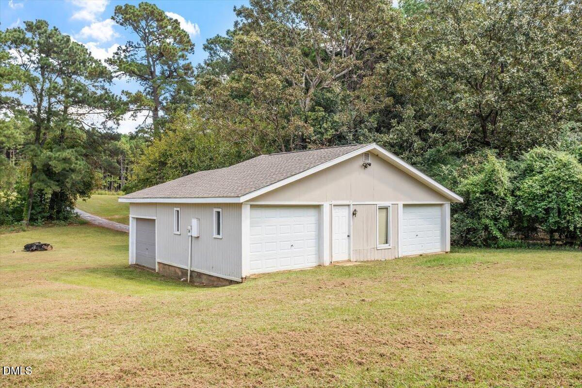 9966 US Highway 421 South Erwin, NC 28339 - Photo 33 of 34 a view of a house with a yard and large trees