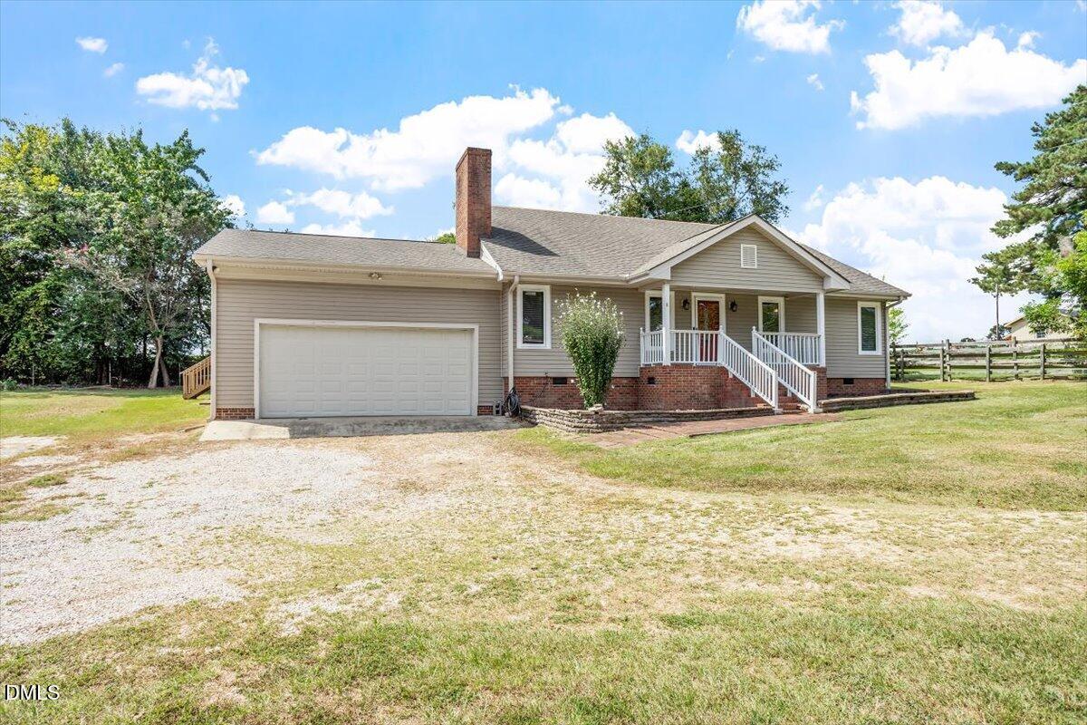 9966 US Highway 421 South Erwin, NC 28339 - Photo 4 of 34 a front view of a house with garden
