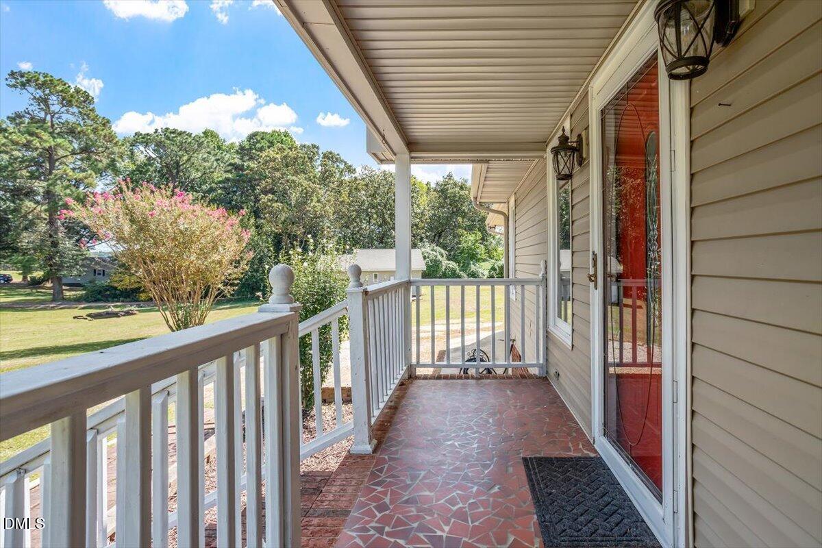 9966 US Highway 421 South Erwin, NC 28339 - Photo 7 of 34 a view of a porch with wooden floor and outdoor space