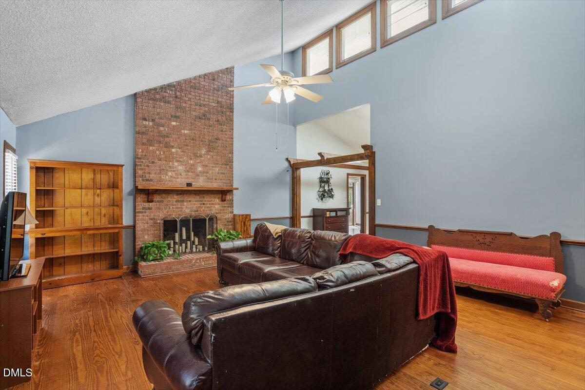 9966 US Highway 421 South Erwin, NC 28339 - Photo 8 of 34 a living room with furniture and a fireplace