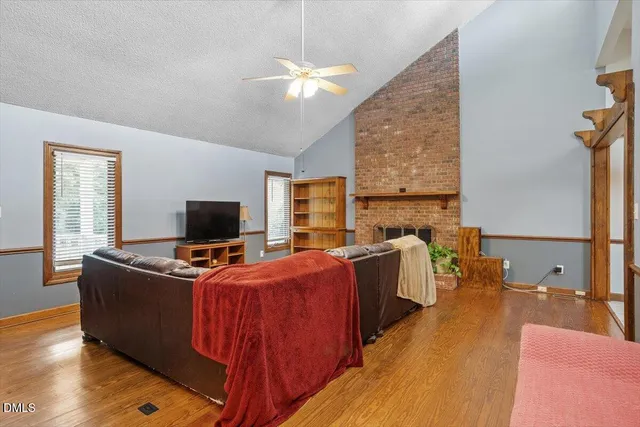 a bedroom with furniture and a flat screen tv