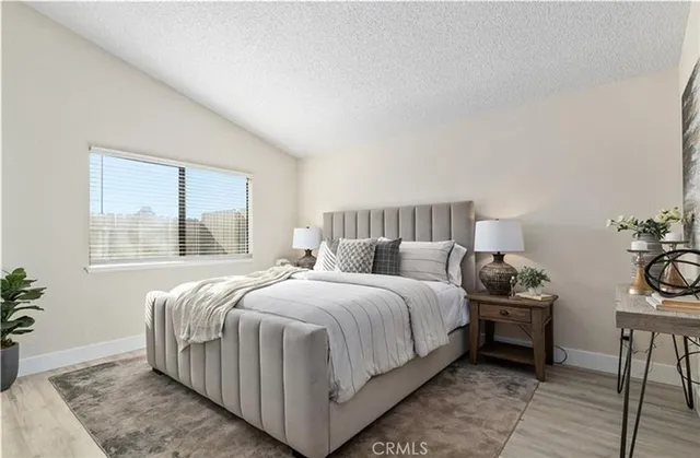 a bedroom with a bed and window