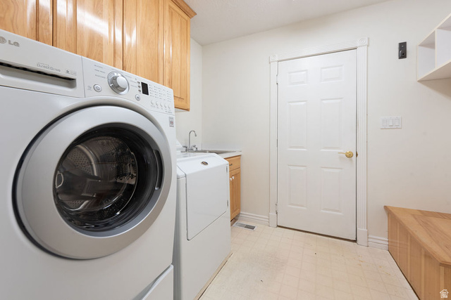 875 East 1300th Street North Mapleton, UT 84664 - Photo 37 of 65 Laundry room with light floors, cabinet space, and washer and clothes dryer