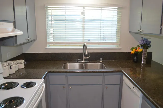 a kitchen with a sink and a window