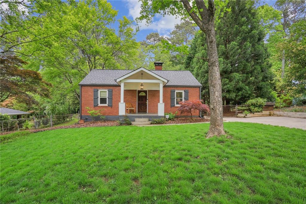 3020 Hollywood Drive Decatur, GA 30033 - Photo 1 of 1 a front view of a house with yard patio and green space