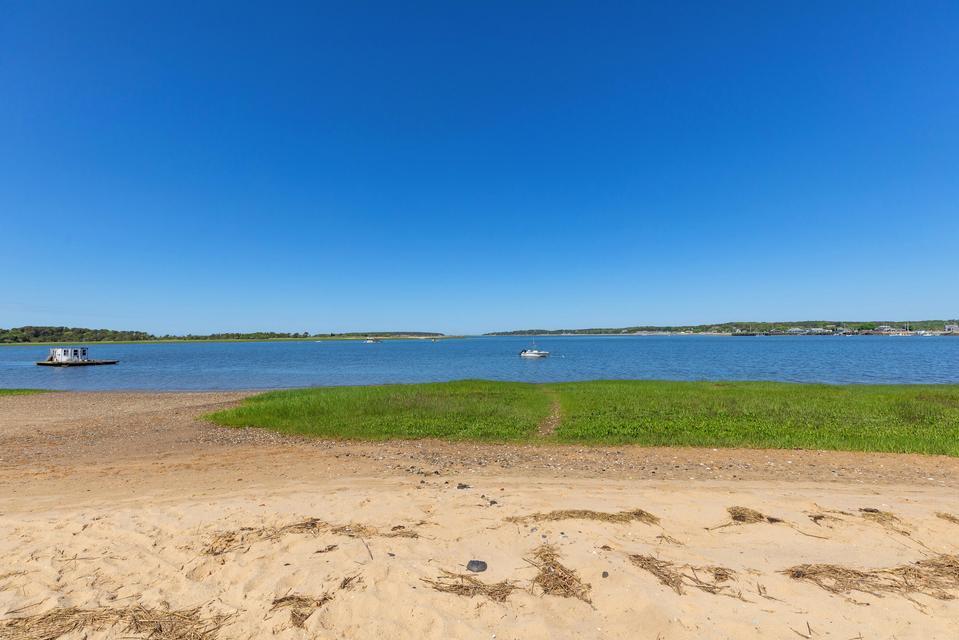 36 Cove Road Wellfleet, MA 02667 - Photo 7 of 22 a view of an ocean and beach