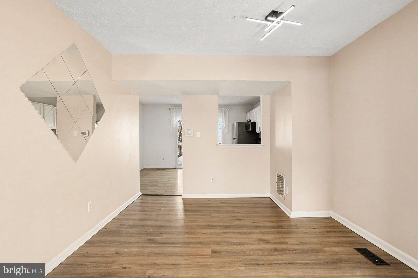 834 West Spring Meadow Court Edgewood, MD 21040 - Photo 4 of 25 a view of empty room with wooden floor and fan