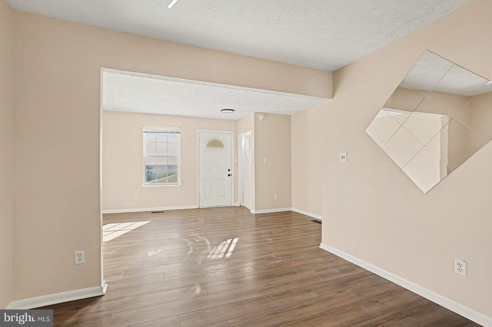834 West Spring Meadow Court Edgewood, MD 21040 - Photo 5 of 25 a view of an empty room with wooden floor and closet