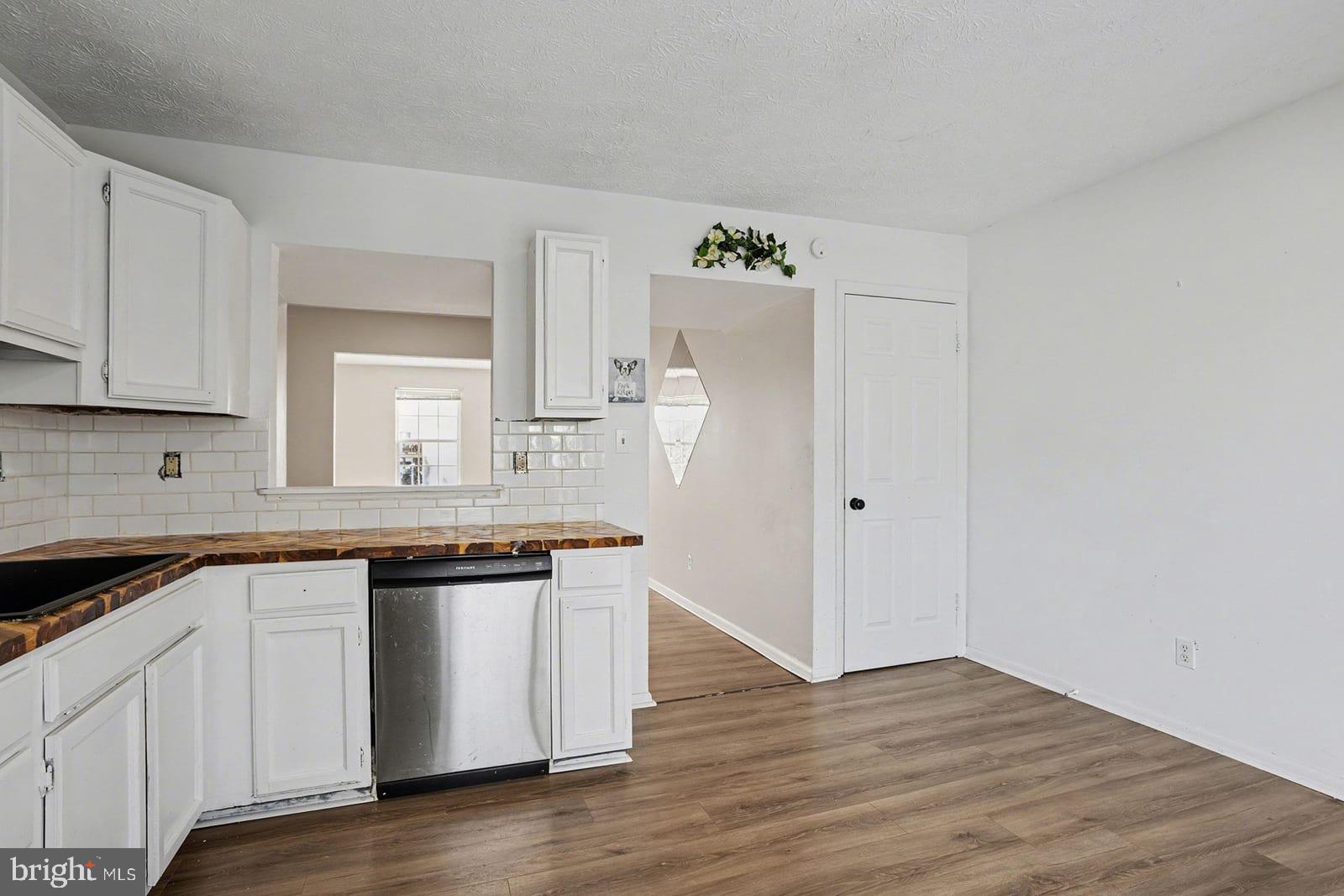 834 West Spring Meadow Court Edgewood, MD 21040 - Photo 7 of 25 a kitchen with granite countertop white cabinets and white appliances