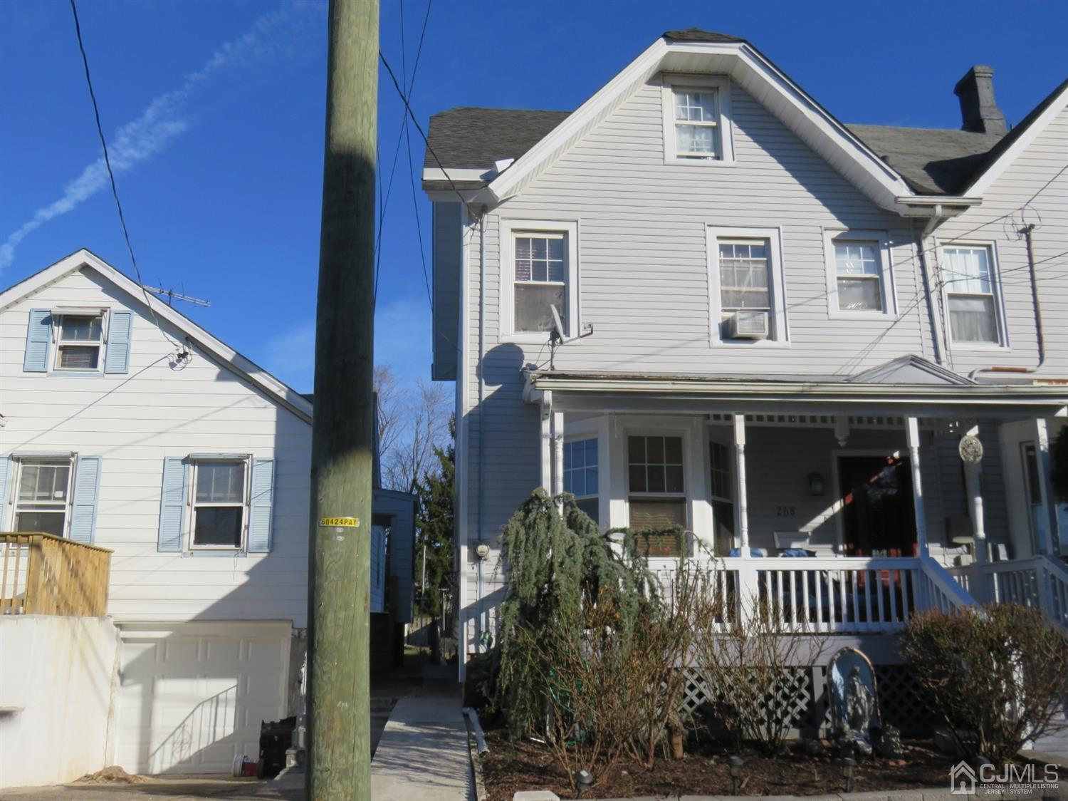 268 Rector Street Perth Amboy, NJ 08861 - Photo 1 of 13 a front view of a house with a garden