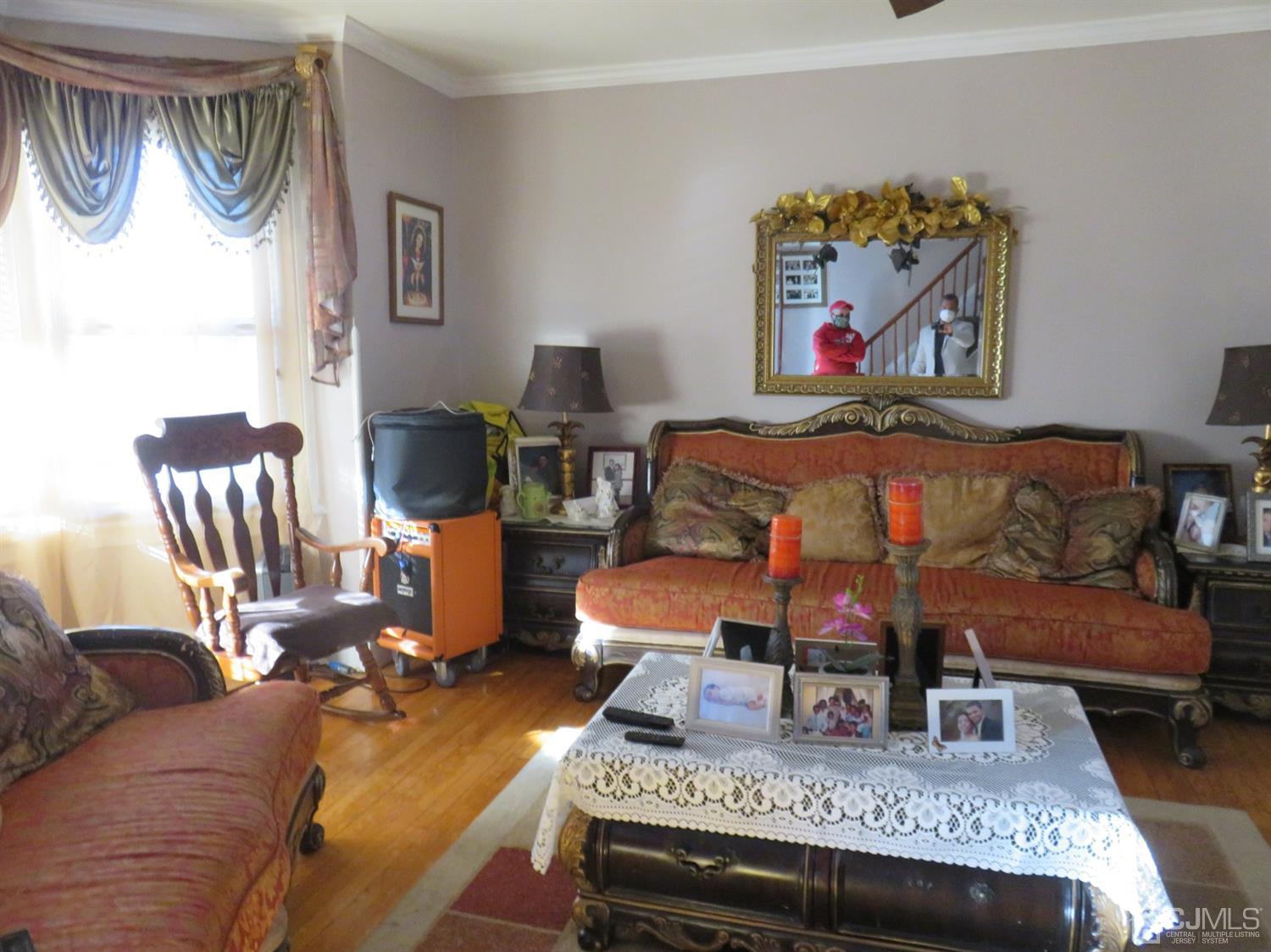 268 Rector Street Perth Amboy, NJ 08861 - Photo 2 of 13 a living room with furniture and wooden floor