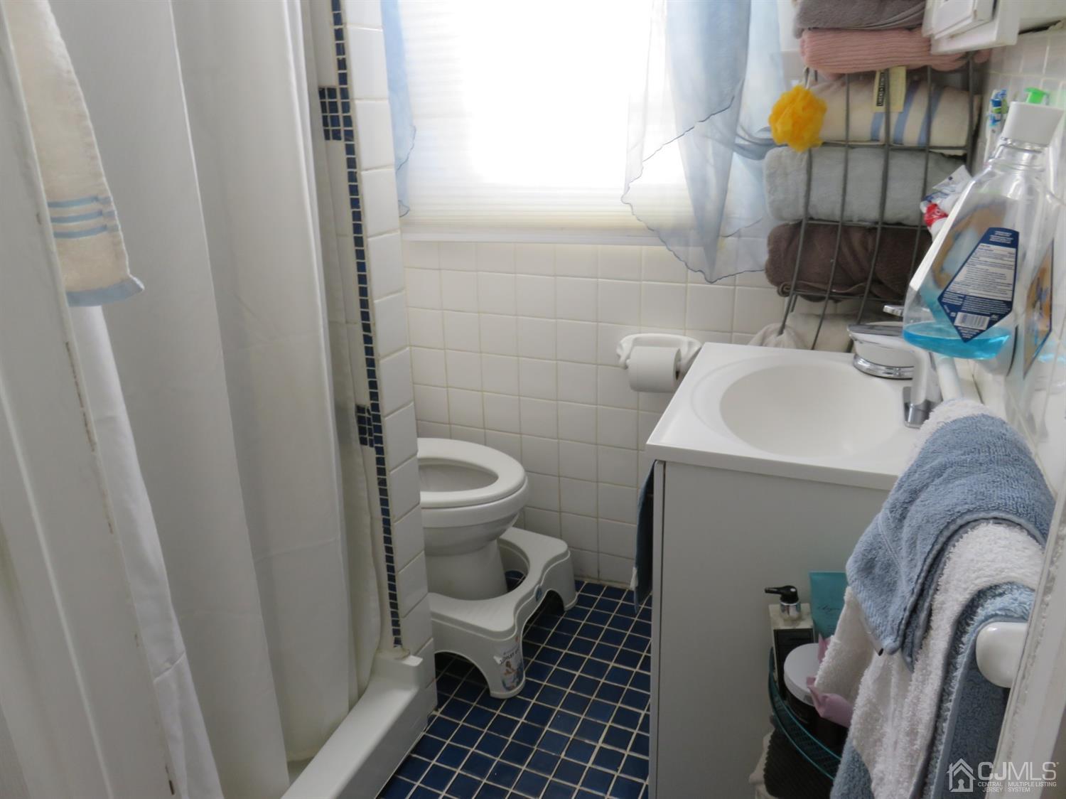 268 Rector Street Perth Amboy, NJ 08861 - Photo 11 of 13 a bathroom with a toilet and a sink