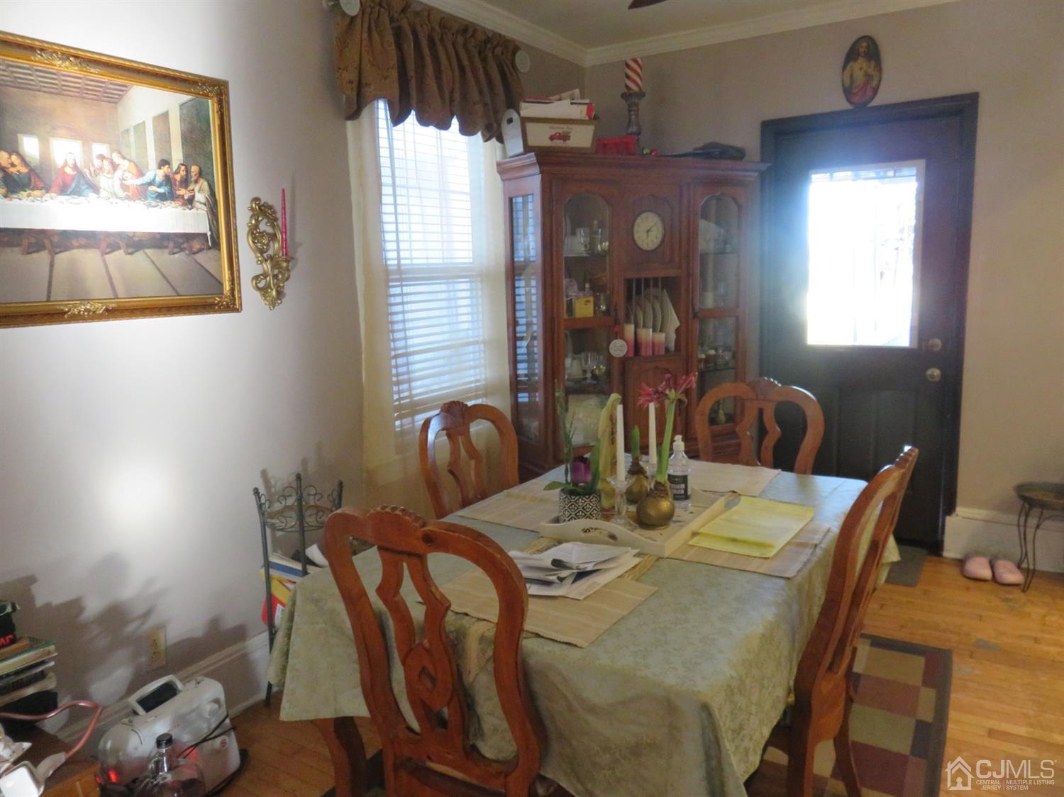 268 Rector Street Perth Amboy, NJ 08861 - Photo 3 of 13 a view of a dining room with furniture and wooden floor