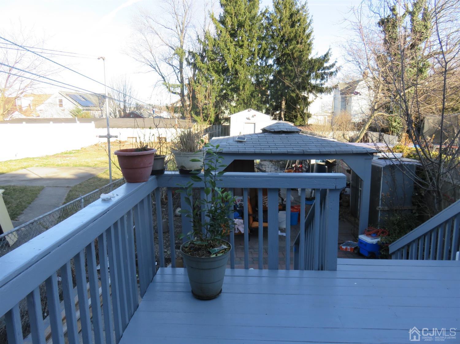 268 Rector Street Perth Amboy, NJ 08861 - Photo 7 of 13 a view of a table and chairs on the roof deck